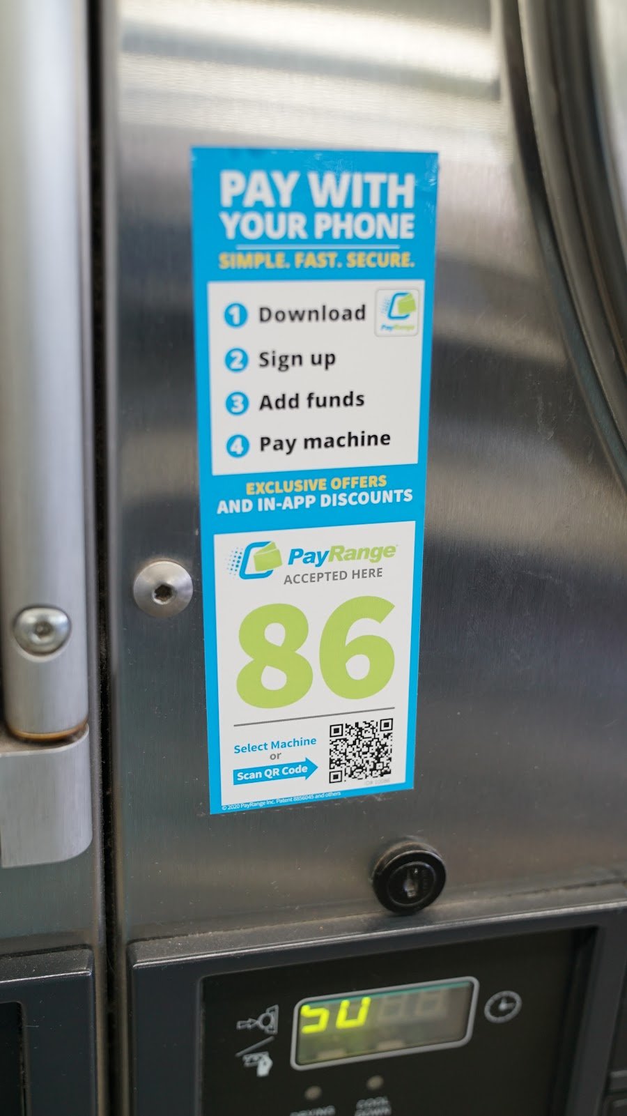 PayRange 'Pay with your phone' sticker on a washer