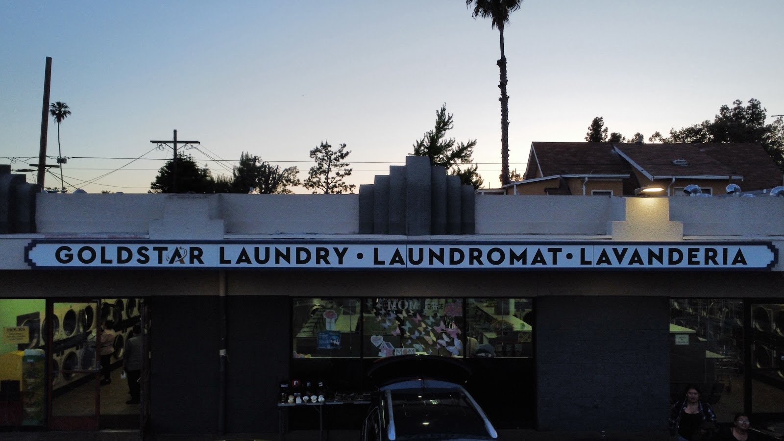 Goldstar Laundry storefront at dusk